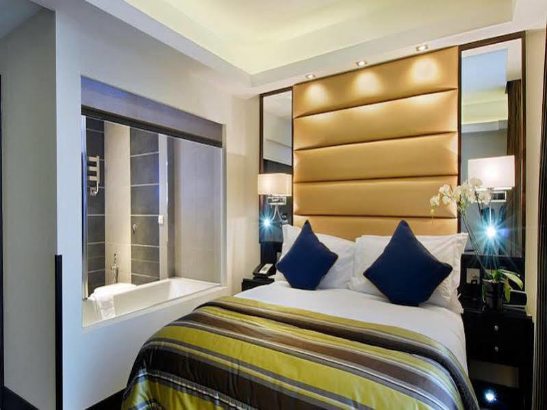 Park Grand Mayfair Лондон Экстерьер фото A bedroom at the hotel
